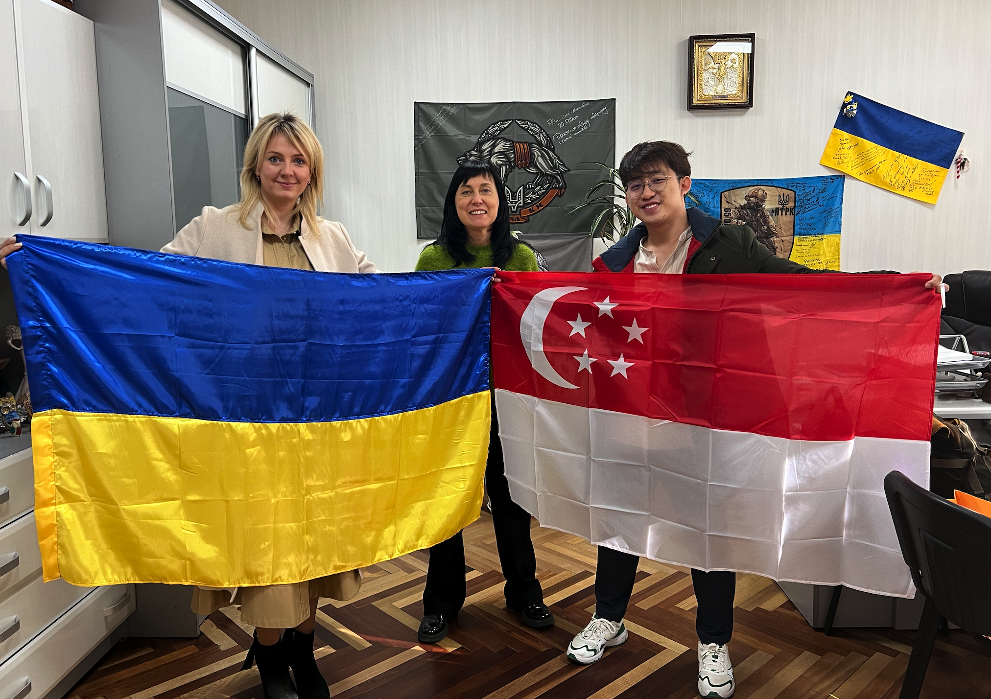 Singapore and Ukraine flags held together
